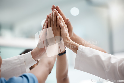Image of High five, teamwork and doctors hands in collaboration for mission, goal or team building together. Mindset, target or medical group with trust, motivation or support for vision, winning or success.