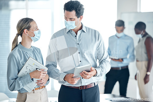 Image of Covid, business people with face mask for office compliance planning, executive discussion and safety risk management with tablet and document. Corporate manager woman with staff corona virus update