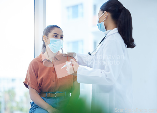 Image of Covid, health and patient vaccine of a doctor consulting a woman in a hospital or clinic office. Healthcare consultant and employee working and helping with medicine and medical advice for dengue