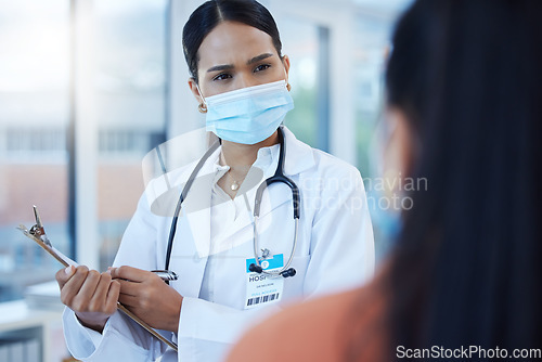 Image of Covid mask, black woman doctor and medical patient at a hospital or clinic ask a health question. Insurance communication, medicine advice and cardiology consultation of a worker with help documents