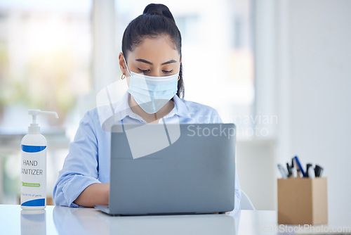 Image of Business woman with laptop, during covid with mask and hand sanitizer for hygiene and health. Young corporate professional, safety and sanitation while working in office during pandemic.