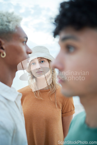 Image of Beauty, fashion and face with a woman or model standing outdoor with her male friends in winter. Portrait, inclusion and diversity with a young female posing outside in a hat on a white background