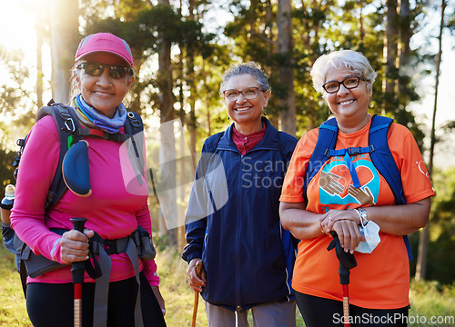 Image of Senior women, portrait smile and hiking or trekking together on an adventure or journey in nature. Group of happy elderly woman hikers smiling in fitness, health and workout exercise in the outdoors