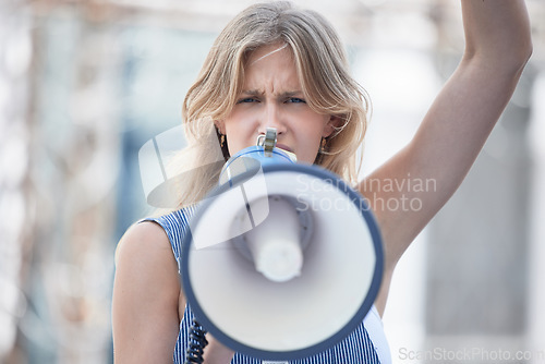 Image of Protest, angry and woman talking with megaphone at a riot in the city of Iran. Face portrait of young girl making noise with an announcement on microphone while speaking about womens rights