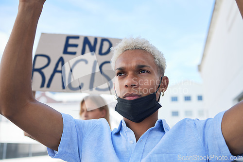 Image of End racism sign, poster and black man protest in face mask, cardboard in urban street for solidarity, race fight and human rights. Volunteer people with board for freedom, equality and violence stop