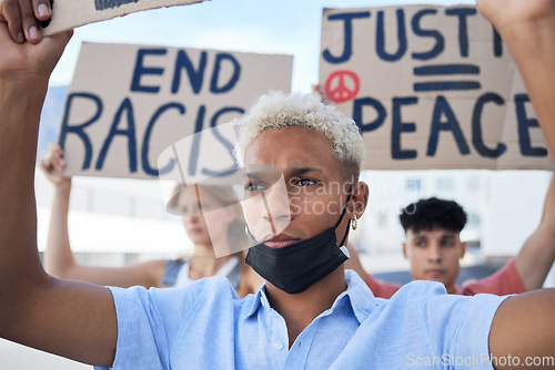 Image of Man, crowd and protest for peace, racism and justice in street with poster in hands. People, sign and writing on cardboard for solidarity, freedom and diversity of race and human rights