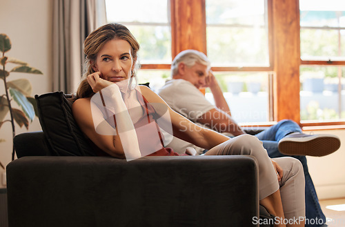 Image of Couple, elderly and angry on sofa for argument, fight or dispute in home together. Stress, sad and frustrated with silence on couch in living room at house with senior, man and woman with depression