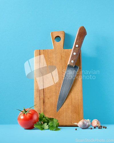 Image of wooden cutting board and knife