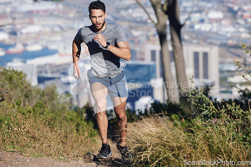 Image of Man is running, fitness and exercise workout for cardio, health and wellness journey in nature outdoors. Young runner, determined and motivation for sports training and healthy lifestyle.