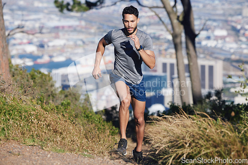 Image of City, runner and man running in nature training, cardio exercise and endurance workout for a marathon. Sports, fitness and healthy athlete on jog on a forest or mountain trail outdoors in summer