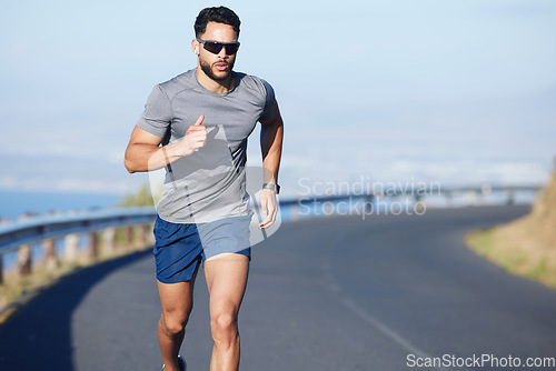 Image of Training, exercise and man running on road in city in summer with ocean background. Fitness, sports and runner with watch on the mountain in South Africa. Exercising, cardio and workout for athlete