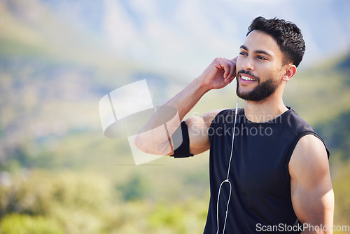 Image of Fitness, man and runner with earphones in nature with smile for healthy, exercise and training mockup. Happy athletic male smiling in sport workout for cardio wellness, health and music in outdoors