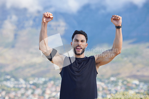 Image of Fitness, winner and yes with a sports man in celebration of a victory outdoor in nature in the mountains. Exercise, training and workout with a young male athlete celebrating his target or goal