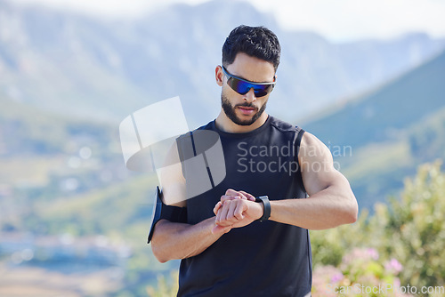 Image of Sports man time smartwatch in outdoor fitness, training exercise time for mountain marathon and tracking heartbeat. Digital stopwatch for workout, monitor performance with technology and runner rest