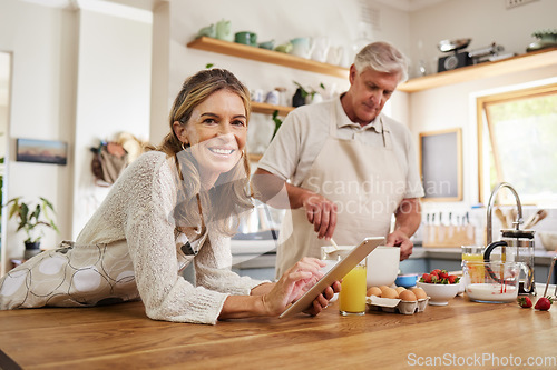 Image of Cooking, tablet and senior couple reading information about food for breakfast on internet in the kitchen. Portrait of an elderly man and woman with digital video recipe on tech for lunch or dinner