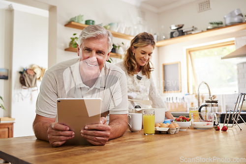 Image of Portrait, senior couple and cooking with tablet together in a modern kitchen of the home. Happy, retirement and elderly man and woman baking with ingredients, recipe and instructions on mobile device