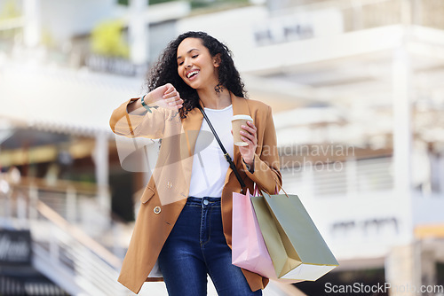 Image of Time, shopping and woman with notification on watch with coffee in the city of Los Angeles. Happy, smile and girl walking with smart technology for fashion deal and retail bag in the mall after sale