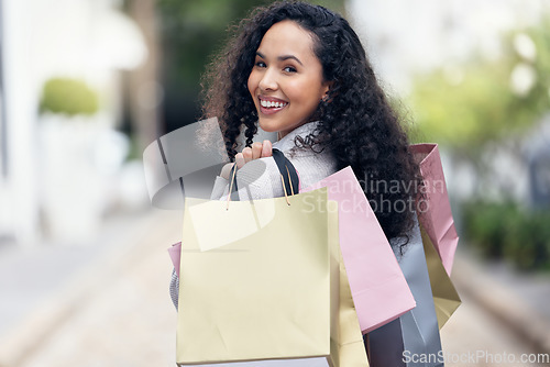 Image of Shopping bag, woman and city travel for retail discount sales, market and fashion promotion in Paris, France street. Portrait happy, rich and wealthy young girl customer buying luxury clothes outdoor