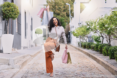 Image of Happy, excited and woman with shopping on outdoor path with smile. Happiness, fashion and city girl with bag from discount sale. Retail therapy, luxury and customer in celebration on street with bag.