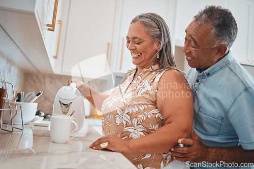 Image of Tea, couple and retirement with a man and woman using a kettle in the kitchen of their home together. Love, morning and romance with a senior male and woman making a coffee beverage in their house