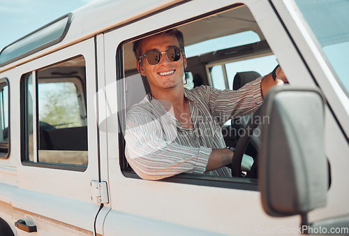 Image of Travel, driving and adventure man in a caravan for outdoor nature journey, holiday in summer or vacation with sunglasses portrait. Young man in a van or car transport for a drive in countryside life