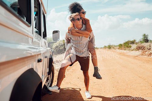 Image of Couple piggy back on road trip travel in Australia, adventure in summer holiday and outdoor truck drive. Young happy people walking on path, fun vacation lifestyle together and transport