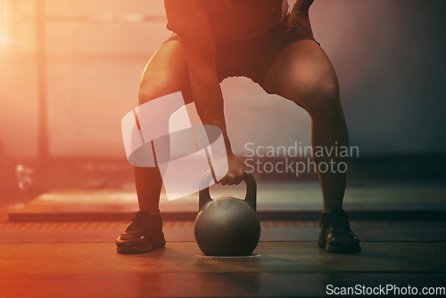 Image of Fitness, gym and sports training with kettlebell of athlete in exercise, workout and motivation indoors. Strong athletic hand ready with sport equipment exercising for strength, health and wellness