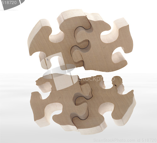 Image of wooden puzzle with reflection