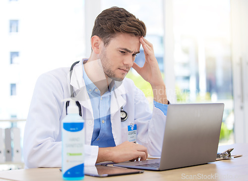 Image of Headache pain, doctor stress and laptop with burnout from hospital work, sad about mental health problem and anxiety working in healthcare. Tired medical expert with depression and mistake at clinic