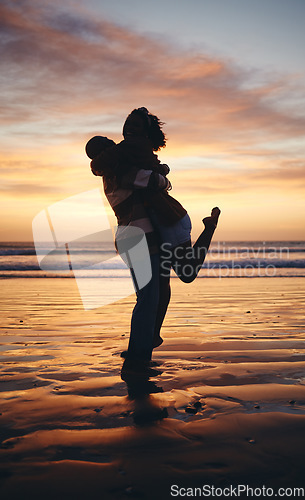 Image of Silhouette couple, sunset beach love and hug on honeymoon, summer tropical vacation and anniversary date together in Maldives. Shadow of man lifting woman, playing and happy ocean holiday freedom