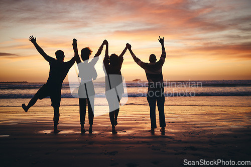 Image of Silhouette, sunset and friends holding hands at the beach on holiday in Miami during summer. Group of people with support, community and calm on a vacation by the water and sea for peace in nature