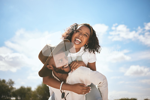 Image of Piggyback, love and couple with smile on a date in nature together during summer. Happy, playful and African man and woman beeing funny, crazy and young in a green park or garden during spring