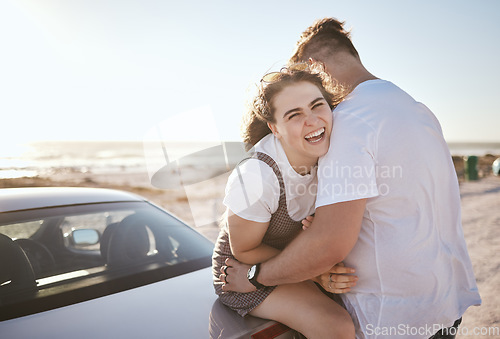 Image of Love, couple and happy while on road trip laugh, playful and relax loving on holiday and at beach sit on car outdoor. Man, woman and on seaside touch, bonding and embrace together on weekend vacation