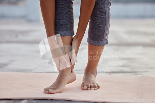 Image of Hands, feet or ankle pain woman on yoga mat in relax workout, training or fitness exercise for health, wellness or mental health. Zoom, woman or foot injury in pilates leg crisis or anatomy emergency