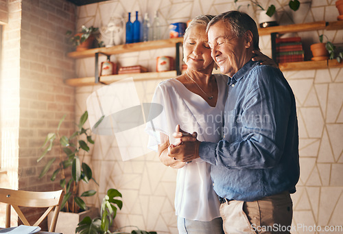 Image of Dance, old couple and love holding hands dancing to music at home in memory of a happy marriage, romance and anniversary. Senior woman enjoy quality time, bonding and romantic retirement with partner