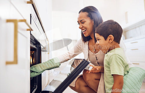 Image of Mother, child and baking in oven learning to make biscuits, cookies or cake in home kitchen. Care, support or love of happy parent bonding, cooking or teaching boy to bake dessert on stove together