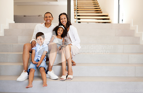 Image of Family, stairs and smile in new home, property or mansion together for mockup portrait. Parents, children and happy in luxury house, real estate or apartment with happiness on face while on staircase