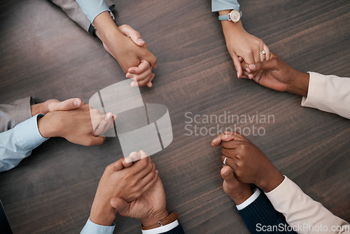 Image of Teamwork, collaboration and business people holding hands before meeting in the office. Diversity, team and support in corporate business with men and women employees connected together in circle