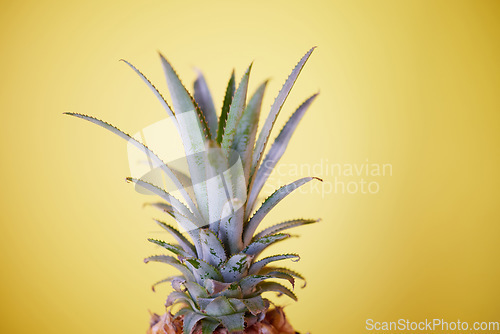 Image of Pineapple, fruit and summer, health and nutrition, tropical and fresh with yellow background. Exotic and refreshing mockup, vibrant closeup of advertising and marketing for healthy lifestyle.