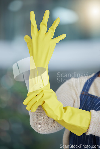 Image of Woman, hands or cleaning gloves for home cleaner, housekeeping service maid or worker. Zoom on healthcare safety, security or rubber protection for medical spring clean, virus or bacteria maintenance