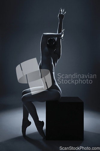 Image of Art, ballet and woman in a dance art deco shadow in a studio training for a performance with dark background. Creative, monochrome and girl dancer or ballerina at theater show, production or concert