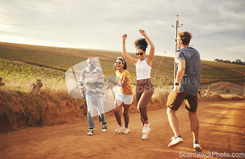 Image of Friends, nature and dance with a man and woman group outdoor in a desert on a sand road with freedom. Travel, summer or vacation with young people enjoying a holiday together and laughing or joking