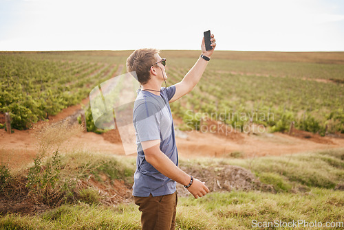 Image of Nature, phone and a man with lost signal in field on farm road trip. Travel, view and vineyard, young traveler with smartphone in agriculture. Gps, wifi or 5g network search on mobile in grass field.