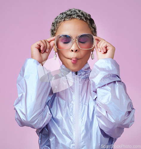 Image of Fashion, beauty and lips with a black woman or model in sunglasses pouting in studio on a pink background. Trendy, style and edgy with an attractive, goofy female posing in contemporary clothes