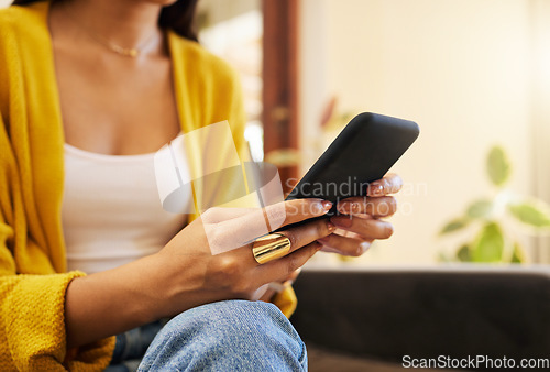 Image of Sofa, home and hands typing with phone chat, social media or networking connection on mobile app, internet or house wifi. Woman with cellphone technology texting message or communication in lounge