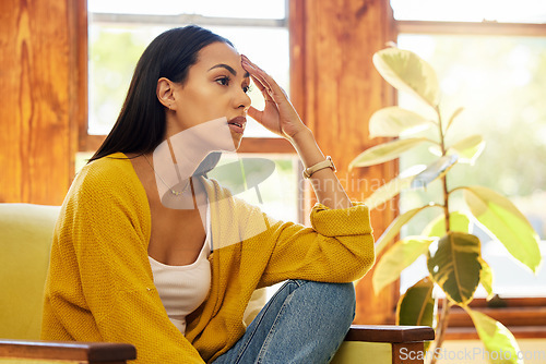 Image of Sad, depressed and thinking woman with mental health problems and anxiety in home. Latino female in depression, stress and fear feeling frustrated, mistake and tired of life living alone in a house