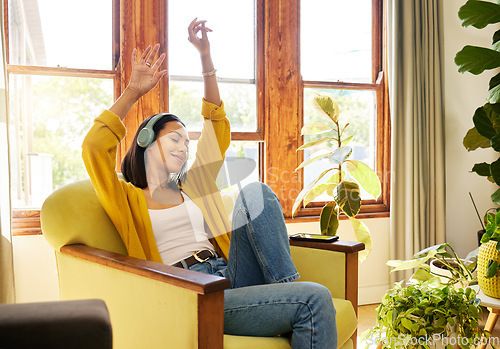 Image of Relax, woman and headphones music in living room for feel good listening leisure in Cancun home. Happy Mexican girl enjoying musical streaming app dancing with arms and eyes closed in lounge.