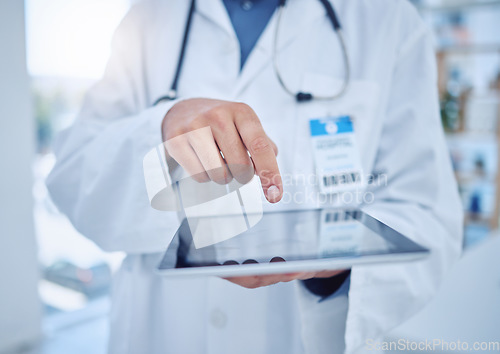 Image of Hands, tablet and healthcare with a doctor doing research or a search on the internet while working in a hospital. Medical, innovation and technology with a medicine professional at work in a clinic