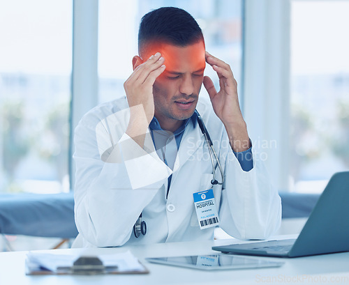 Image of Doctor, headache and hospital with burnout, laptop and technology tired at workplace. Medic, hands and head with pain, frustrated and stress working in clinic, medical or healthcare facility in Miami