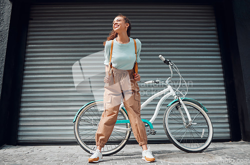 Image of Woman, happy and bike with backpack on travel in city with fashion on road outdoor. Black woman, bag and smile for holiday, tourism or or vacation with bicycle in summer on street in San Francisco